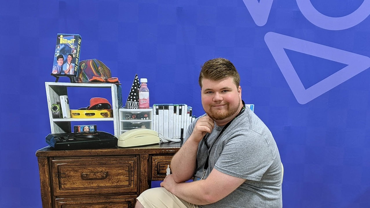 Justin sitting in Scott the Wozz's chair.